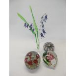 A collection of paperweights, some with floral canes, intaglio paperweight decorated duck, a small