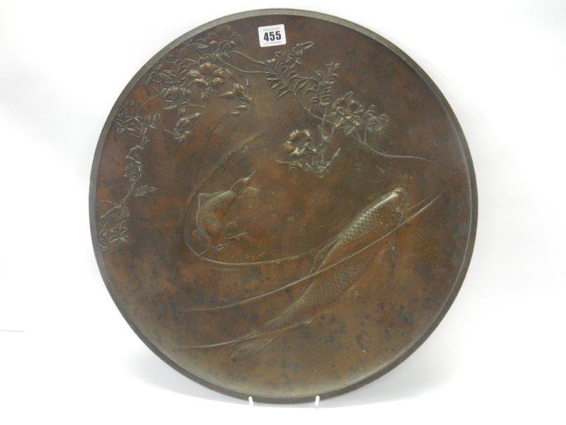 A large Japanese Meji bronze charger decorated with carp in relief - 18in. dia.