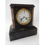 A Victorian mantel clock with white enamel dial by J.W Benson, in a black slate and marble case