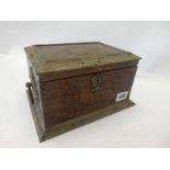 An oak box, the lid mounted in repousse decoration metal with cupids, fitted end handles - 10in.