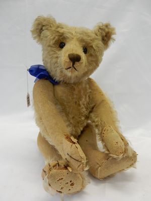 A Steiff teddy bear in golden mohair with articulated limbs