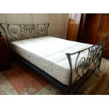 A Silent Night Miracoil 4ft. 6in. mattress complete with brushed steel bedstead
