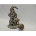 Two cast iron Mr Punch door stops, two Victorian marble balls and a model of a frog