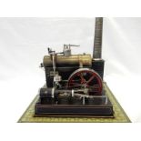 A Bing static steam model live steam engine with painted tin plate chimney and fly wheel, on