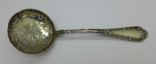 A continental pierced silver sugar spoon, marked .