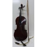 A violin, with paper label, Guarnerius, length of back without button 36.