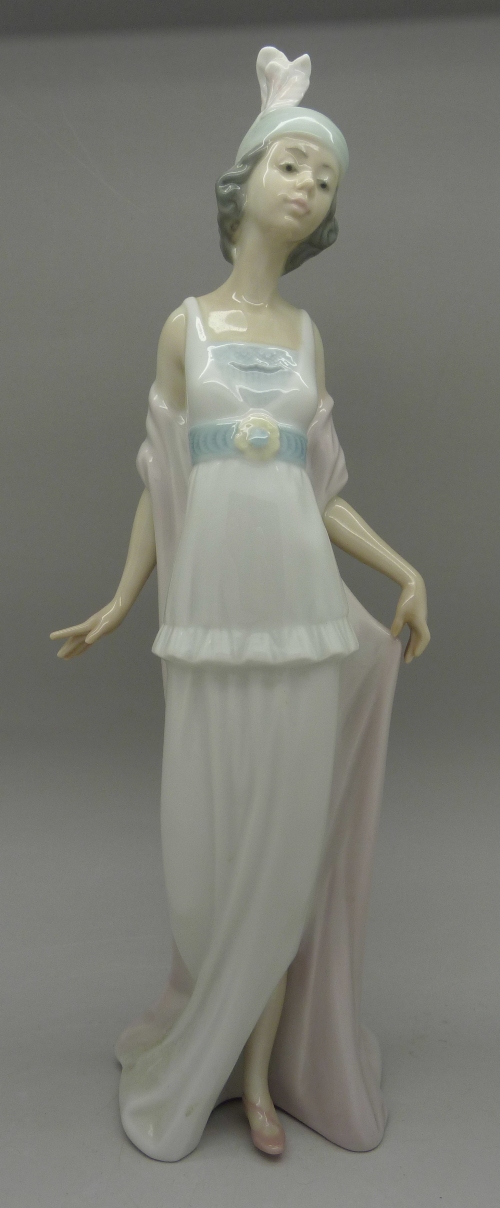 A Lladro figure, 5788, Talk of The Town, boxed,