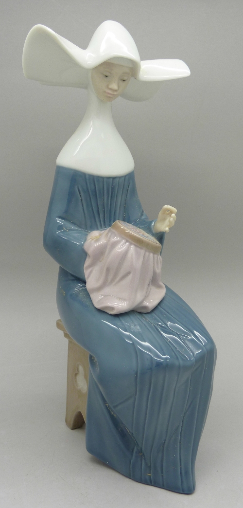 A Lladro figure, 5501, Time to Sew, boxed, height 20.