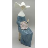 A Lladro figure, 5501, Time to Sew, boxed, height 20.