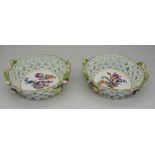 A pair of Dresden small bon bon dishes with central floral panels encrusted with flowers,
