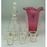 An Art Deco glass liqueur set and a cranberry glass vase,