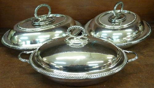 A pair of plated entree dishes and one other plated entree dish marked Barker Bros.
