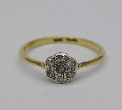An 18ct gold, platinum and diamond daisy style ring, weight 2g,