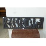 An African carved wood panel