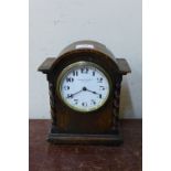 An oak mantel clock, the dial signed Coventry Lever Co. Ltd.