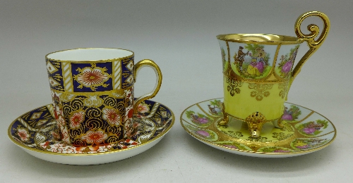 Two cabinet cups and saucers comprising Royal Crown Derby 2451 pattern and Karlshader