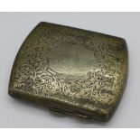 A chased silver cigarette case, 85g,