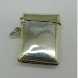 A silver vesta case