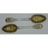 A pair of Victorian silver berry spoons