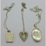 Three silver lockets and chains