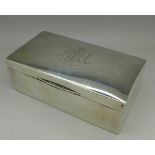 A silver cigarette box with inscription dated 1928,