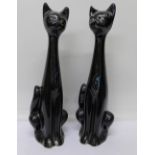 Two retro long-neck cat figures