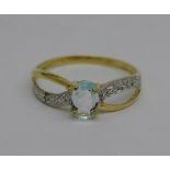 A 9ct gold, diamond and blue stone ring, 0.