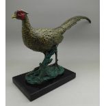 A cast, cold painted model of a pheasant on a base, width of base 14.