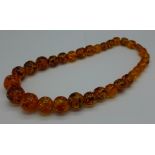 An amber necklace, 133g,
