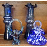 A pair of blue glass vases and two blue glass baskets,