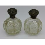 A pair of silver topped scent bottles, Birmingham 1906,