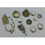 A silver and gold applied pigeon fob by Fattorini, a silver locket, a silver and paste brooch,