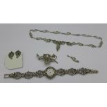 A collection of marcasite jewellery, necklace, earrings and matching brooch,
