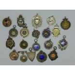 Twenty silver fobs, 198g, 7oz, including sports