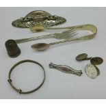 Silver including cufflinks, a baby's bangle, a pickle fork, sugar bows, an enamelled brooch,