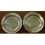 A pair of silver serving plates, London 1773, maker Thomas Heming, diameter 24.