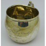 A silver mug, 92g, with inscription dated 1925,
