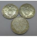 Three German funf mark coins,