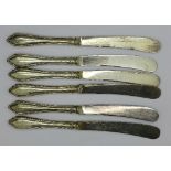 A set of six silver handled butter knives