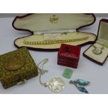 A collection of jewellery including a silver and abalone brooch, a silver locket,