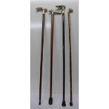 Four walking canes with novelty handles; dog, boar,