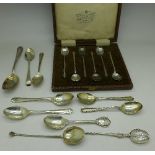 A cased set of six silver coffee spoons and ten other silver spoons including golfing,