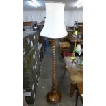 A mahogany barleytwist standard lamp