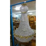 A large gilt metal and crystal chandelier (no wiring)