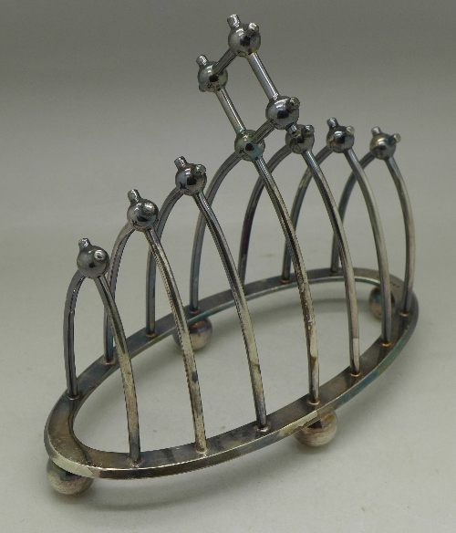 An Arts and Crafts silver plated toast rack