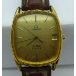 A gold plated Omega De Ville quartz wristwatch, calendar dial, 1337 calibre, leather strap,