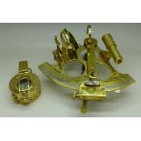 A brass reproduction compass and a brass reproduction octant