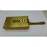 A combination compact, powder, comb and cigarette case,