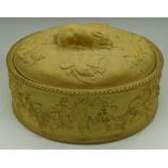 A Wedgwood relief moulded oval pate dish decorated with game