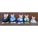 A set of five Nat West pig money banks and World Savers coins and folder